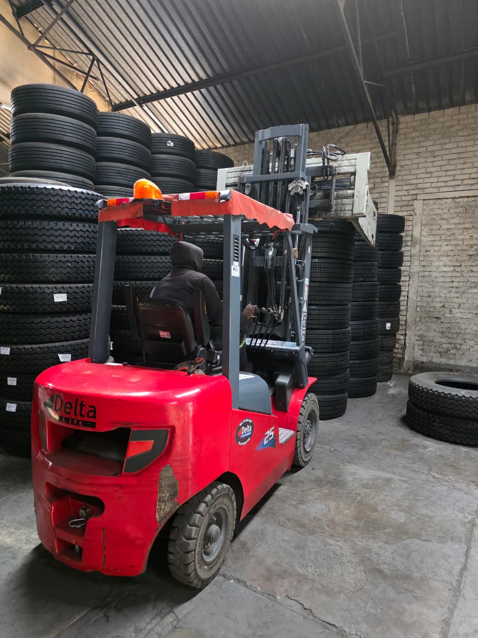 Forklift warehouse aisle with Delta equipment