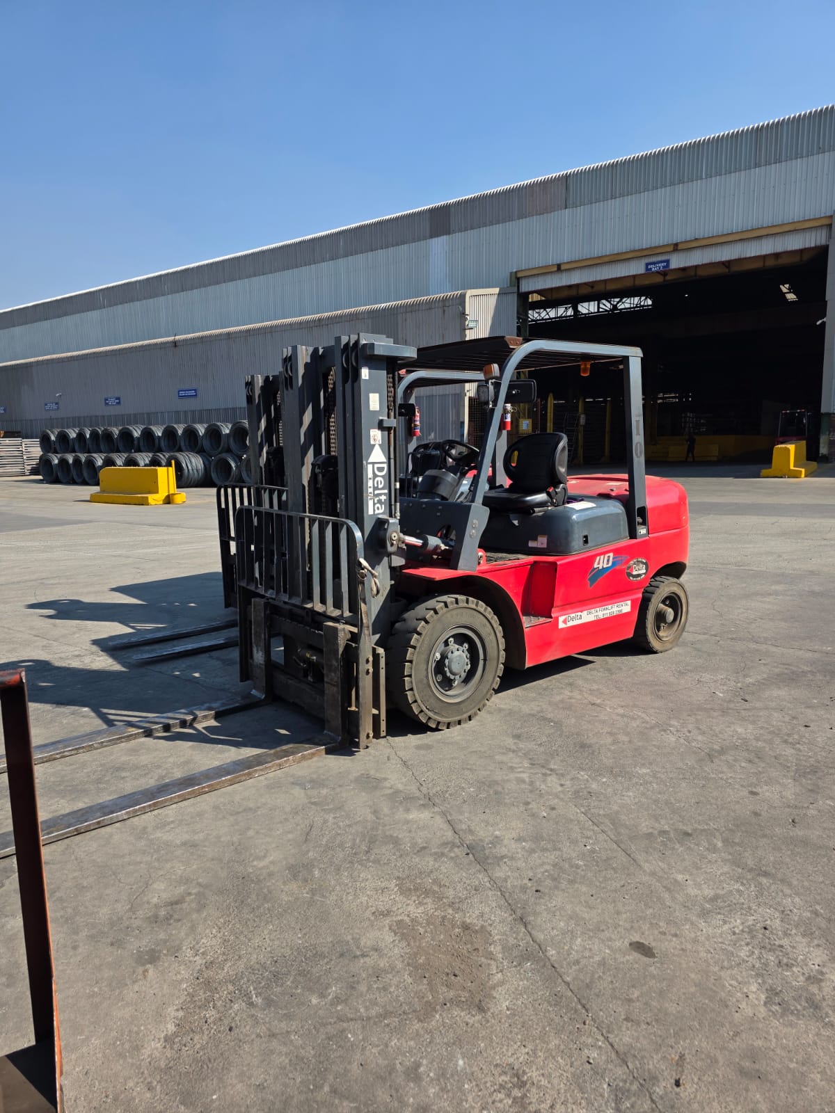 Forklift warehouse aisle with Delta equipment