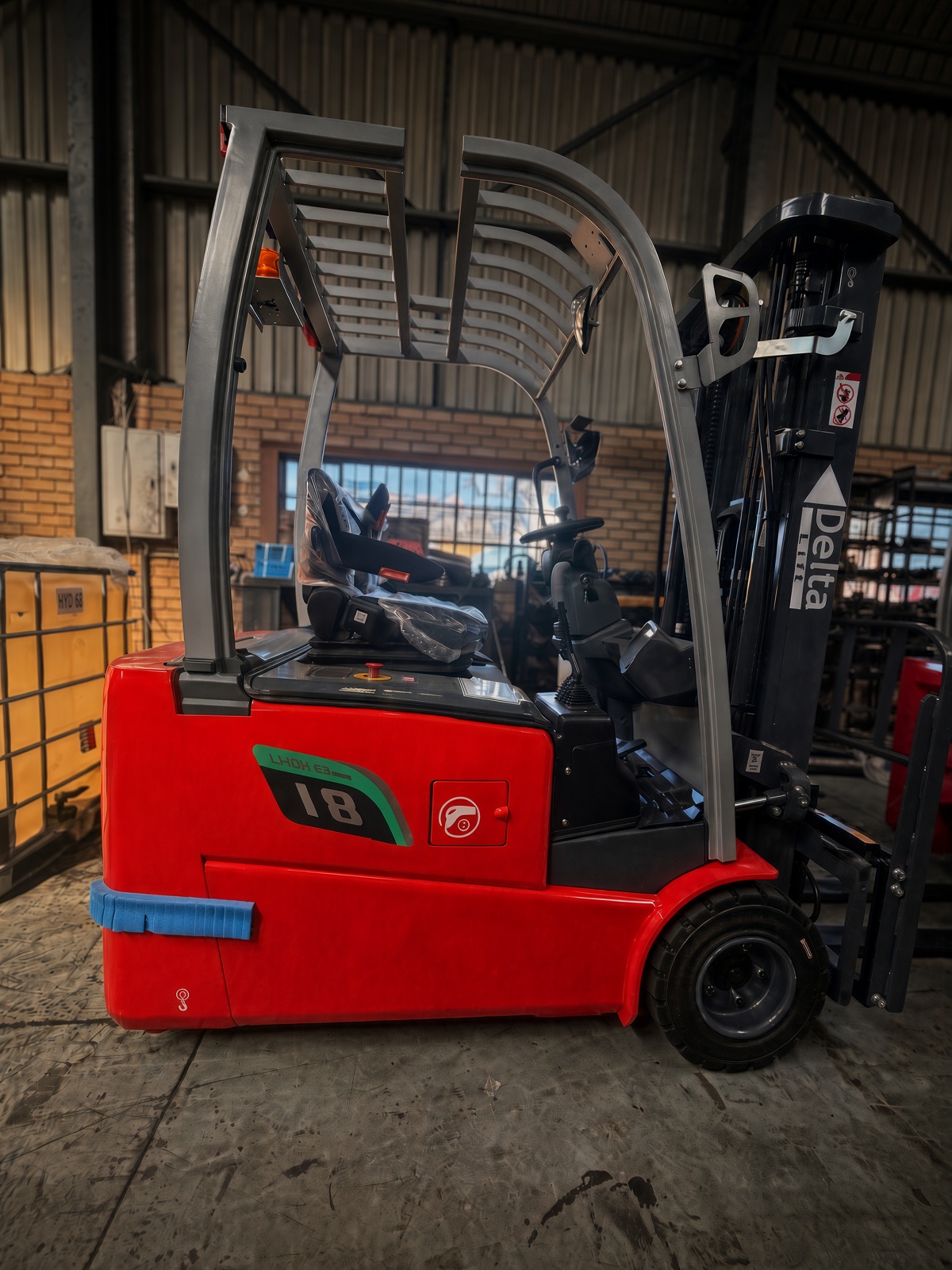 Forklift in warehouse aisle