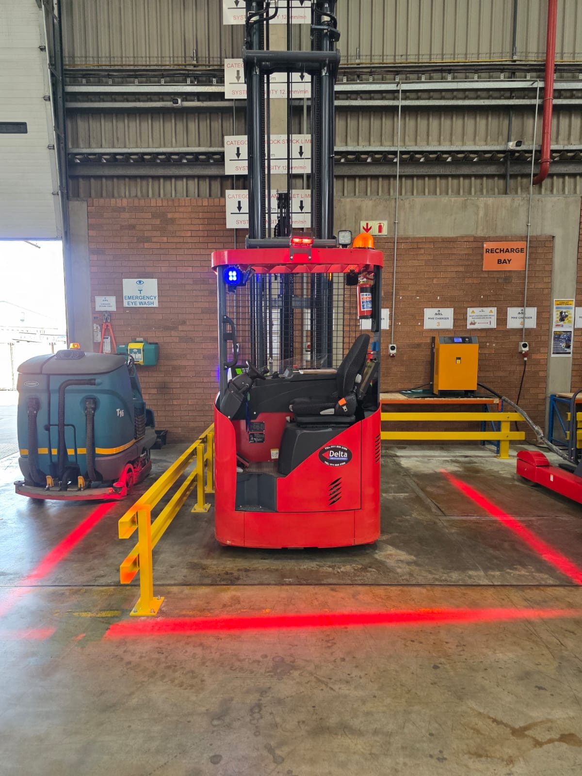 Forklift in warehouse aisle